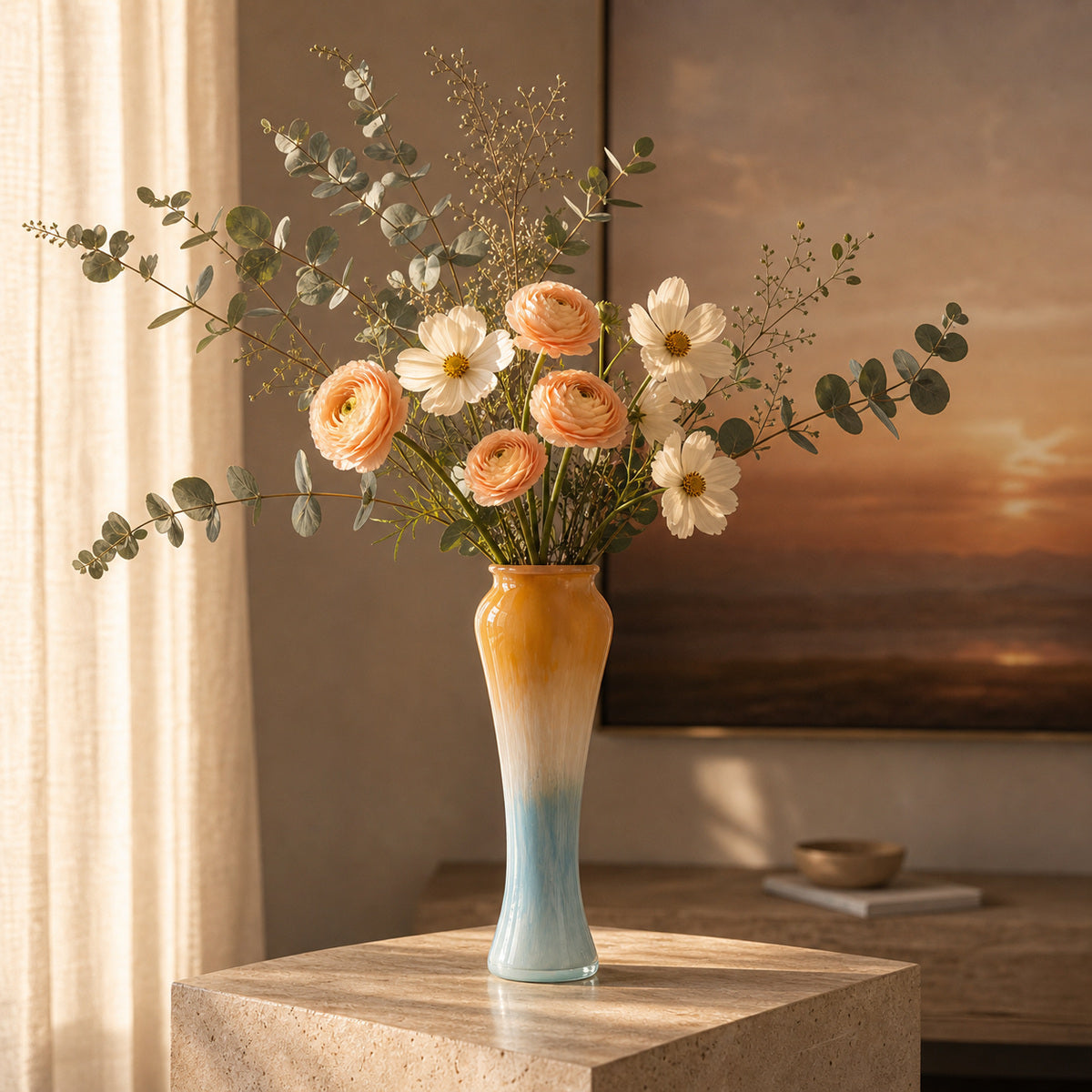 Bouquet of flowers in Onda Vase Solis sitting on a gallery plinth in warm sunset lighting