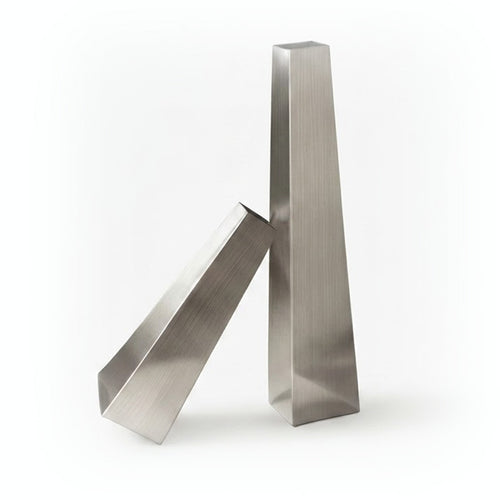 Two matte brushed metallic sculptures on a white background