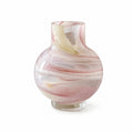 Glass vase with pink and white marbled pattern on a white background